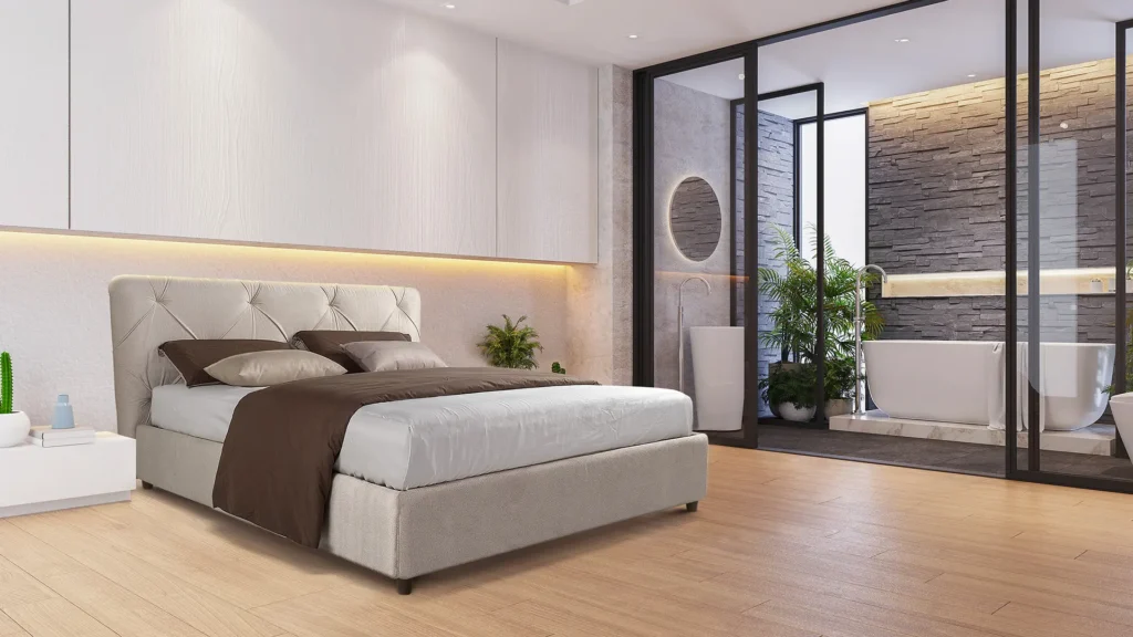 Imaginea ilustrează: Pășește într-un dormitor modern și confortabil, cu elegantul pat Pat ca piesă centrală. Relaxează-te pe lenjerie de pat moale în alb și maro, înconjurat de podele calde din lemn și un decor simplu și elegant. Notele de verdeață dau viață camerei, în timp ce o baie proprie, deschisă, cu o frumoasă cadă independentă și un perete decorativ din piatră, adaugă o notă de lux rutinei tale zilnice. Pentru mai multe detalii, vizitați site-ul thebed.ro!